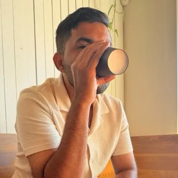 Nick, founder of Baked, drinking coffee